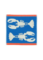 Towel with lobster design on a blue background