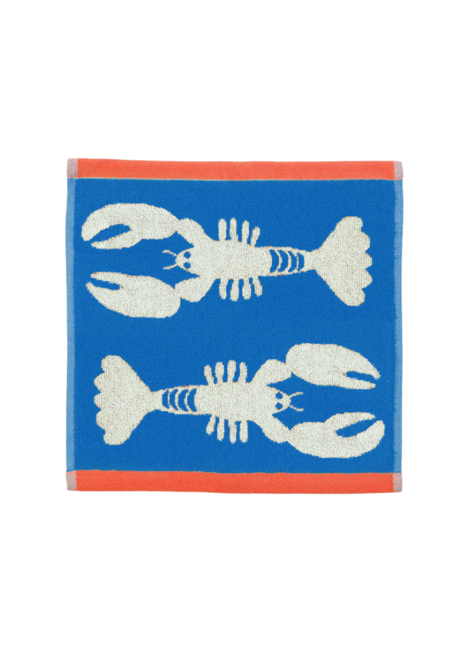 Towel with lobster design on a blue background