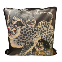 Decorative pillow with animal design on a chair in a room setting