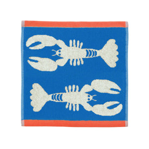 Towel with lobster design on a blue background