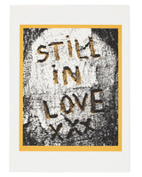 Framed artwork with 'STILL IN LOVE' text on a textured background