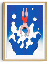 Framed artwork of a swimmer in red shorts against a blue background with white splashes.